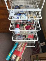Overview of baskets with wrapping paper, ornaments, hardware