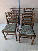 All four ladder-back chairs, front and side view