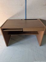Front view of brown veneer desk