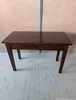 Front perspective of bench showing overall structure and legs