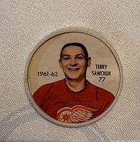 Front of Shirriff 1961-62 Terry Sawchuk plastic hockey coin showing player image and text
