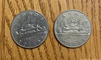 Both 1972 Voyageur dollars, reverse side