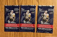 Front view of three sealed Tim Hortons 2025-2026 Upper Deck NHL trading card packs