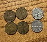Six Canadian 5 cent coins arranged in two rows showing reverse designs and dates 1942, 1943, 1951