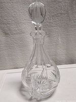 Full view of decanter with stopper in place showing overall form and cut pattern