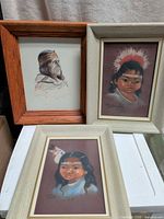 Group shot of three framed portraits