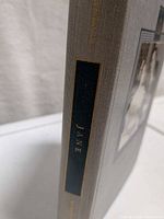 Spine showing black panel with gilt title