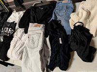 Overview of jeans, tops and sweater