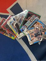 Assorted rookie cards overlapping showing foil and parallel designs