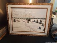 Framed winter landscape painting overall view