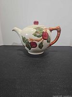 Side view of Franciscan Apple teapot showing design and handle