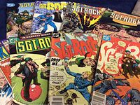 Eight vintage Sgt Rock comics arranged with covers visible showing different issues and wartime illustrations.