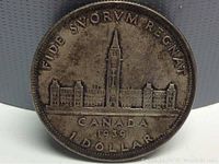 Obverse side of 1930 Canadian silver dollar with similar design, for comparison.