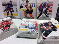 Multiple hockey cards from the 1996-97 Donruss set displayed upright featuring players from various NHL teams including Rangers, Flyers, Avalanche, Senators, Maple Leafs, Penguins.