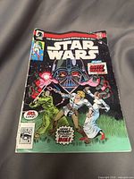 Front cover of Star Wars comic featuring Darth Vader, Luke Skywalker, Princess Leia