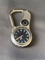 Front view showing dial, compass and carabiner clip