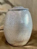 Front view of textured salt-glaze vase