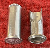 Both pipe fillers upright on red fabric