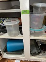 Overview of plastic containers, lids, pans