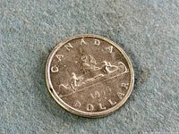 Reverse of 1955 Canadian Voyageur silver dollar