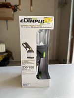 Front of boxed Blackfire ClampLight Reactor lantern showing product, model name, clamp handle