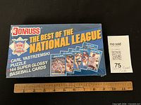 Front of sealed Donruss Best of the National League boxed set with ruler for scale