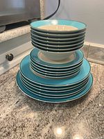 Stack of bowls and plates showing color scheme and quantity