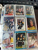 Page of nine Mario Lemieux Penguins cards in binder