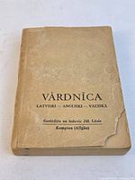Front cover showing title and damaged corner