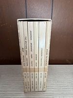 Spines of eight Junior Great Books volumes inside slipcase