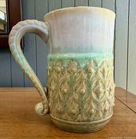 Profile view left showing handle and full relief pattern