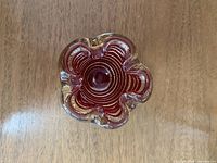 Top view showing red spiral interior, ruffled rim