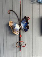 Full view of metal butterfly wall hook showing overall form and hanger