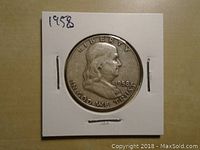 Obverse side of the 1958 Franklin US Silver Half Dollar coin showing Benjamin Franklin's profile with inscriptions LIBERTY, IN GOD WE TRUST, and the year 1958.