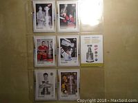 Front view of six Canadian hockey legend postage stamps in protective sleeves with Stanley Cup imagery.