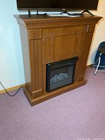 Full view of electric fireplace showing mantel and firebox