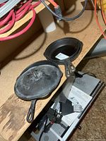 Two frying pans, one with McClary lid