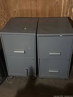 Front view of both gray two-drawer file cabinets on casters