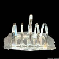 Front view showing six slots, handle, base design