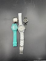 Four watches arranged side by side