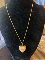 Full view of necklace on display bust showing pendant and chain length