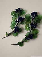 Full view of both glass grape clusters showing overall design