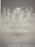 Six clear jellyfish stem martini glasses front view