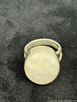 Top view showing round moonstone cabochon and bezel