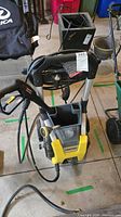 Front view of Kärcher K1700 pressure washer with spray gun and hose