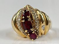 Front view showing rubies, diamonds and ribbed band