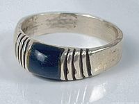 Front view showing onyx cabochon and ribbed shoulders