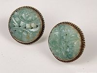 Both earrings front view showing carved stones and rope bezel