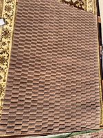 Top view of full rug showing geometric brown tan pattern