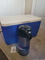 Coleman cooler with Thermos carafe in front